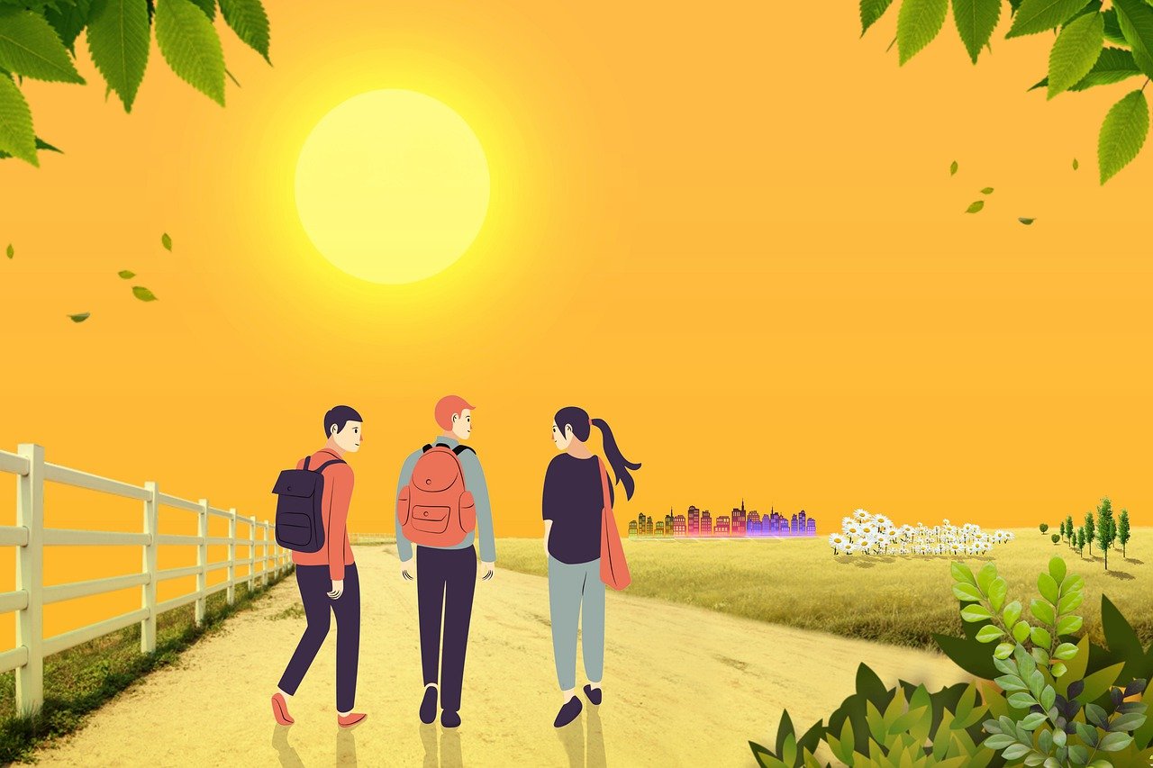 Three people walking towards a sunset, on the road to recovery.